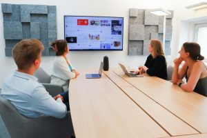 Team evaluating technology during a conference room meeting