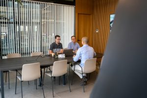 Executives discussing an agreement at a conference table