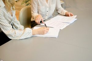Business professionals reviewing licensing documents